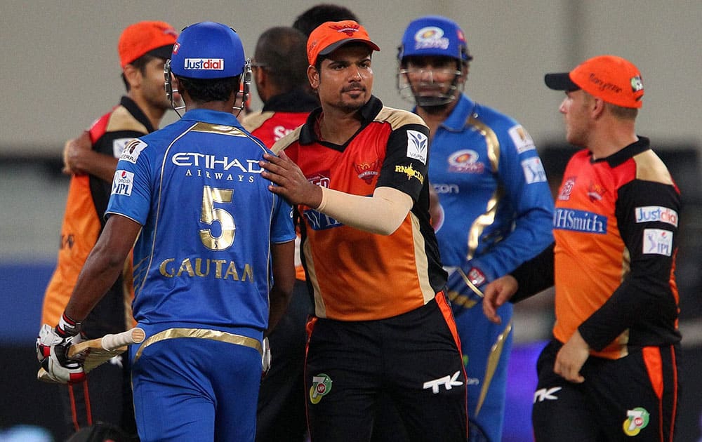 Players shake hands after the match during IPL 7 match between the Mumbai Indians and the Sunrisers Hyderabad in Dubai.