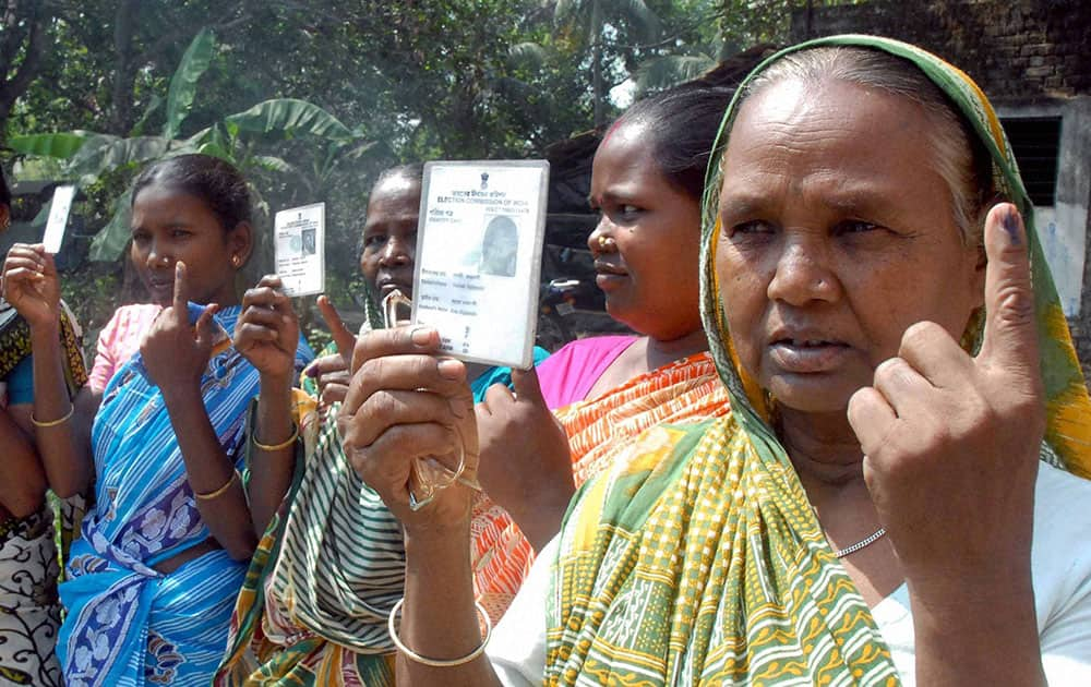 Women showing their inked fingers after casting their votes at a polling station at Chunchura in Hooghly district of West Bengal on Wednesday during 7th phase of Lok Sabha elections.