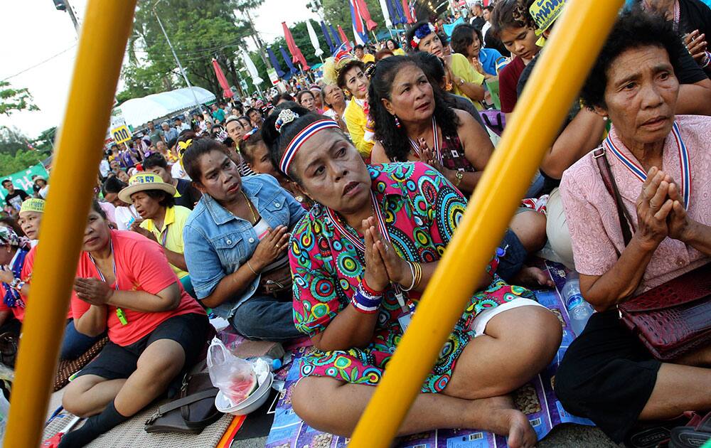 Anti-government protesters chant prayers during a rally in Bangkok, Thailand. The protesters, in their final major rally, were seeking for the country to be reformed and demanded caretaker Prime Minister Yingluck Shinawatra to resign.