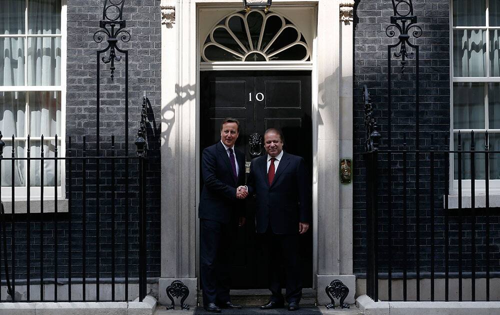 Prime Minister of Pakistan Nawaz Sharif meets with British Prime Minister David Cameron, as he arrives for a meeting at 10 Downing Street in London.