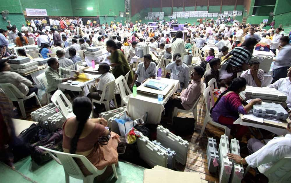 Election officials distribute EVM`s on the eve of Lok Sabha Election at Polo Ground in Patiala.