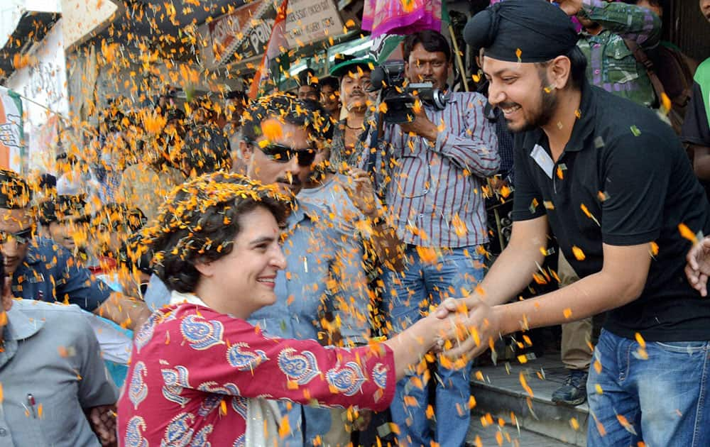 Priyanka Vadra interacts with people during an election campaign for her mother and Congress President Sonia Gandhi in Raebareli.