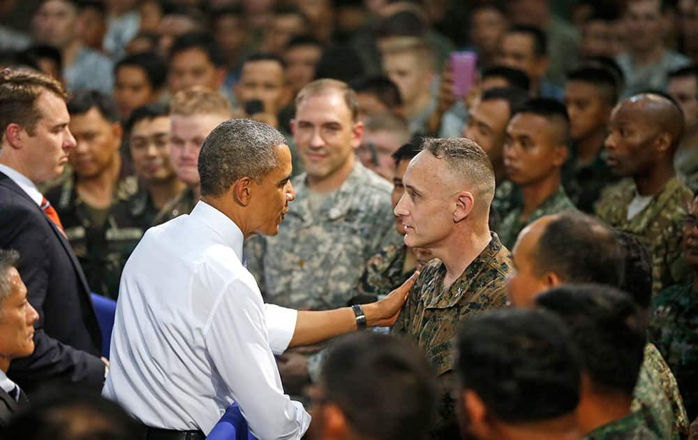 President Barack Obama greets US and Philippine troops at Fort Bonifacio in Manila, the Philippines.