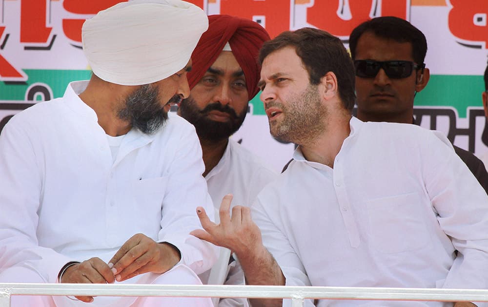 Congress Vice President Rahul Gandhi with party candidate Manpreet Singh Badal at an election rally in Bathinda.