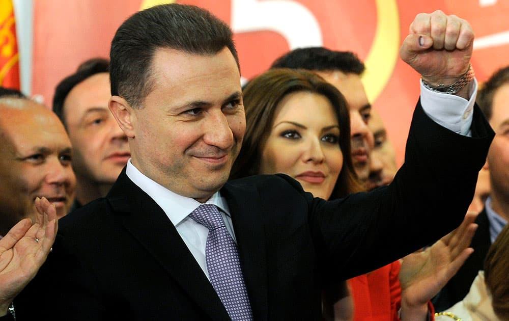 Macedonian Prime Minister and leader of the ruling conservative VMRO-DPMNE Nikola Gruevski, rises his fist while announcing a double victory in parliamentary and presidential elections, in Skopje, Macedonia.