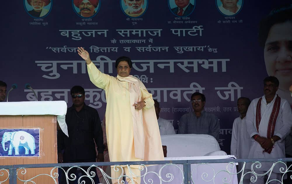 Bahujan Samaj Party president Mayawati waves to supporters at an election rally in Allahabad, Uttar Pradesh state, India.