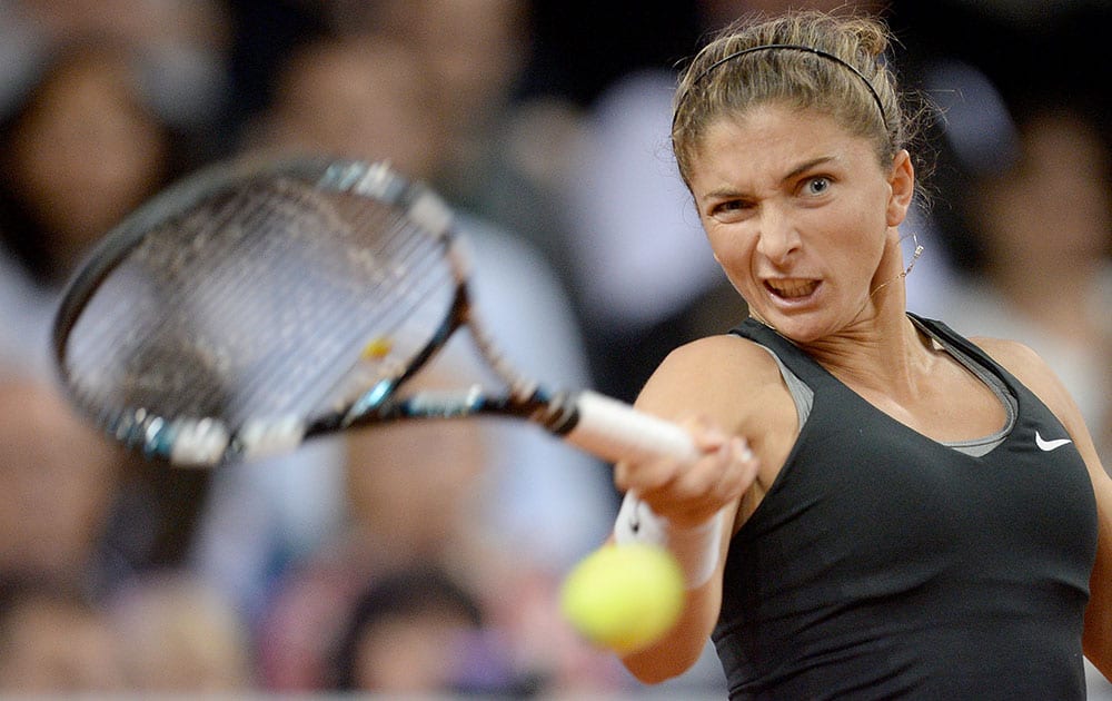 Sara Errani of Italy returns the ball to Russia`s Maria Sharapova during their semifinal match at the Porsche tennis Grand Prix in Stuttgart, Germany.