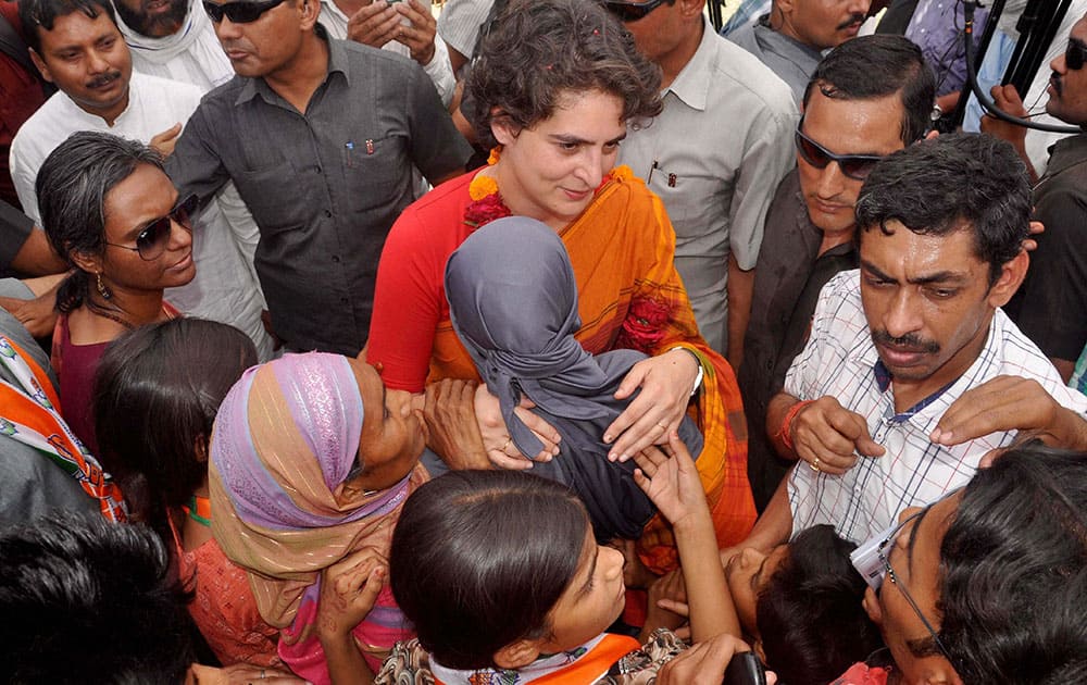 Priyanka Vadra interacts with people during an election campaign for her brother and Congress Vice President Rahul Gandhi in Amethi.
