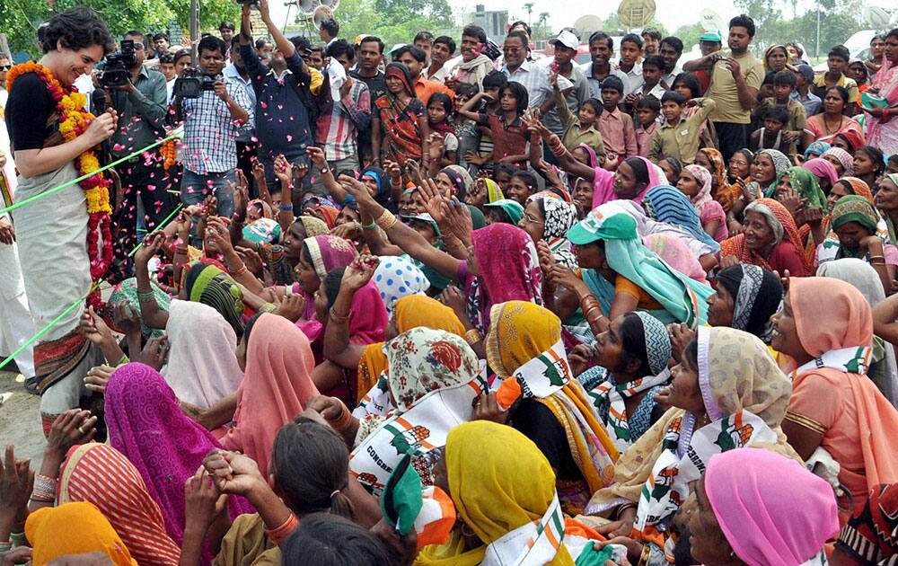 Priyanka Vadra, daughter of Congress party president Sonia Gandhi, interacts with village women during an election campaign in her mother’s constituency of Rae Bareli.