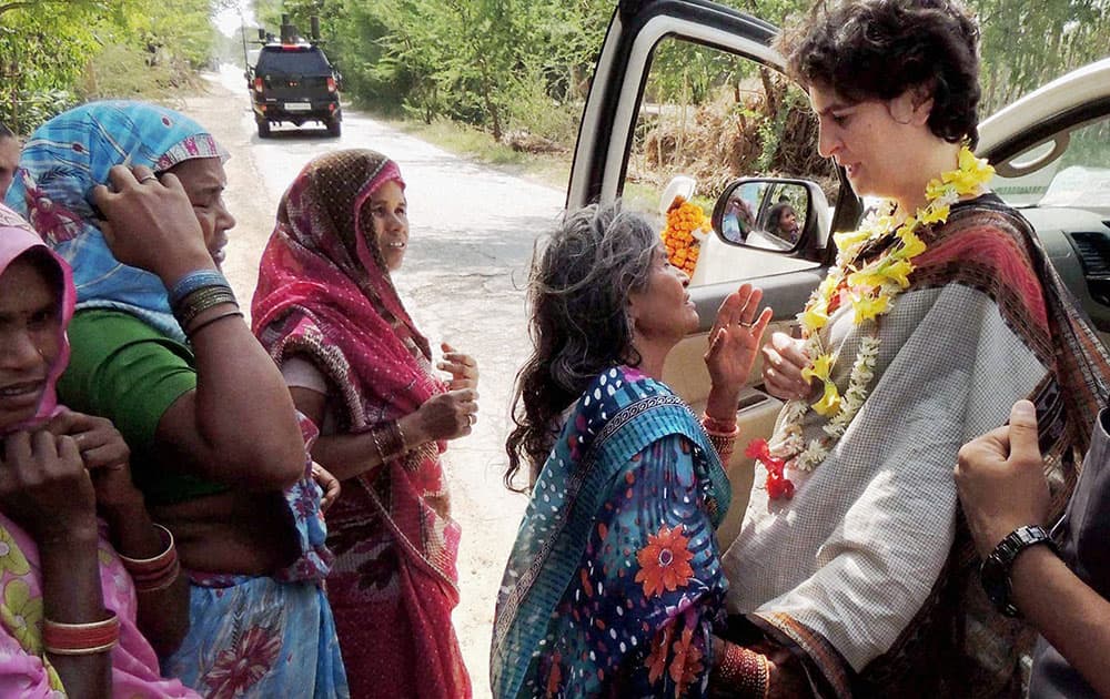 Priyanka Vadra, daughter of Congress party president Sonia Gandhi, interacts with village women during an election campaign in her mother’s constituency of Rae Bareli.