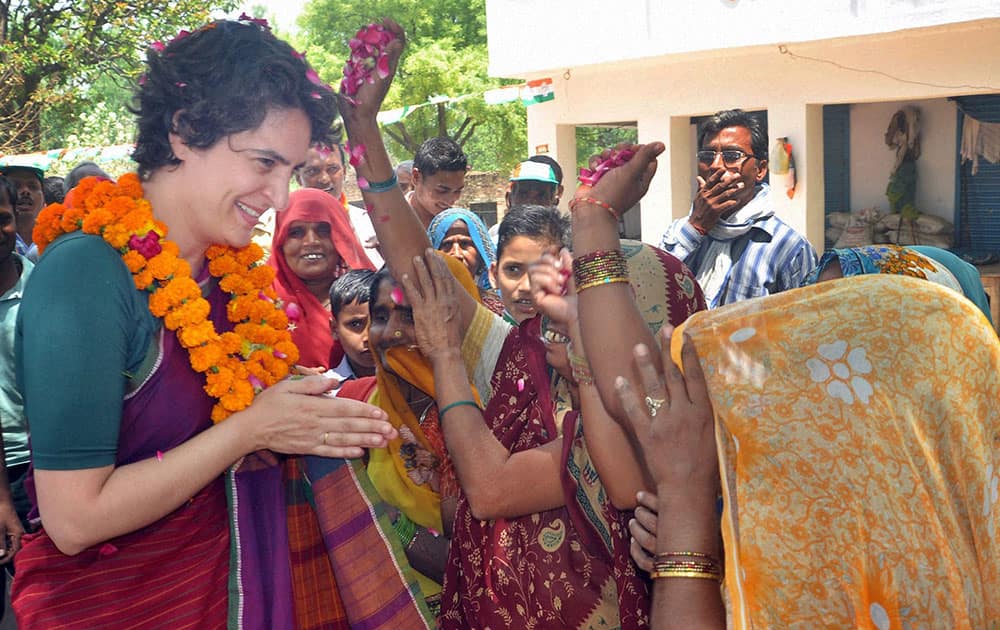 Supporters shower flower petals on Priyanka Vadra, daughter of Congress party president Sonia Gandhi, during an election campaign in her mother’s constituency of Rae Bareli.