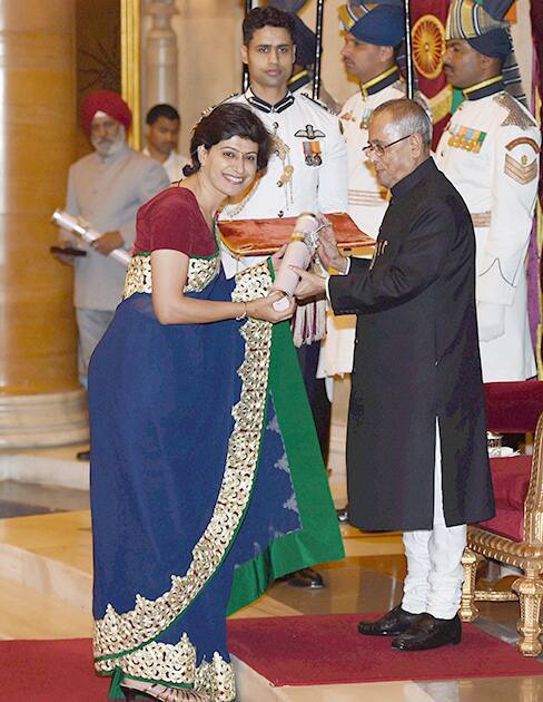 President Pranab Mukherjee presents Padma Shri to cricketer Anjum Chopra during Padma Awards 2014 function at Rashtrapati Bhavan in New Delhi.