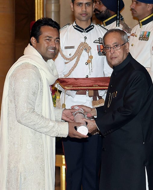 President Pranab Mukherjee presents Padma Bhushan to tennis star Leander Paes during Padma Awards 2014 at Rashtrapati Bhavan in New Delhi.