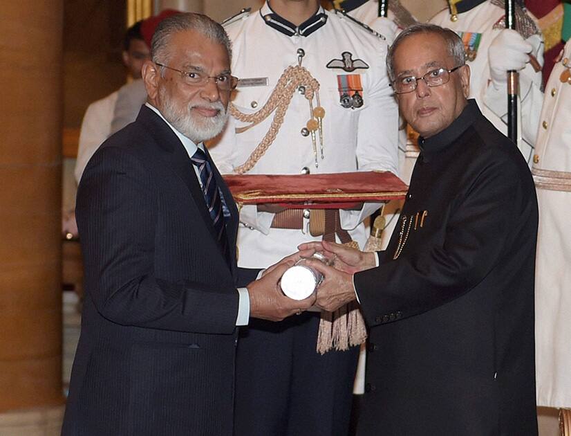 President Pranab Mukherjee presents Padma Bhushan to ISRO Chairman Radhakrishnan Koppillil during Padma Awards 2014 function at Rashtrapati Bhavan in New Delhi.