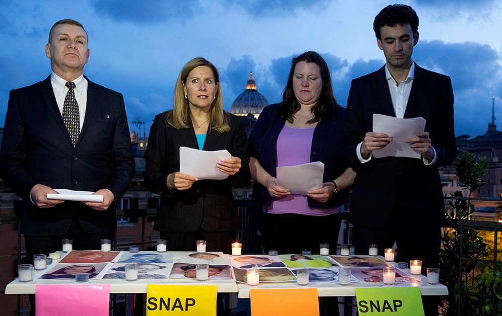 Members of SNAP (Survivors Network of those Abused by Priests), from left, David D`Bonnabel from Austria, President Barbara Blaine from the US, Nicky Davis from Australia, and Miguel Hurtado from Spain read a letter denouncing abuses in Rome.