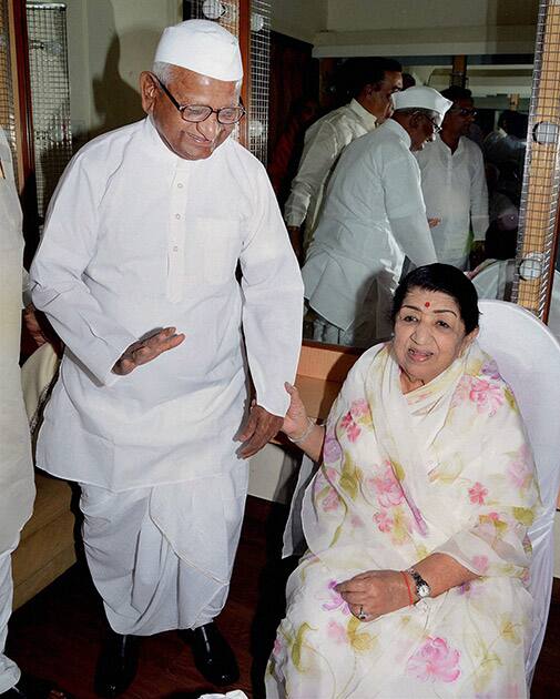 Legendary singer Lata Mangeshkar with social activist Anna Hazare at a function on the occasion of Dinanath Mangeshkar`s 72nd death anniversary in Mumbai.