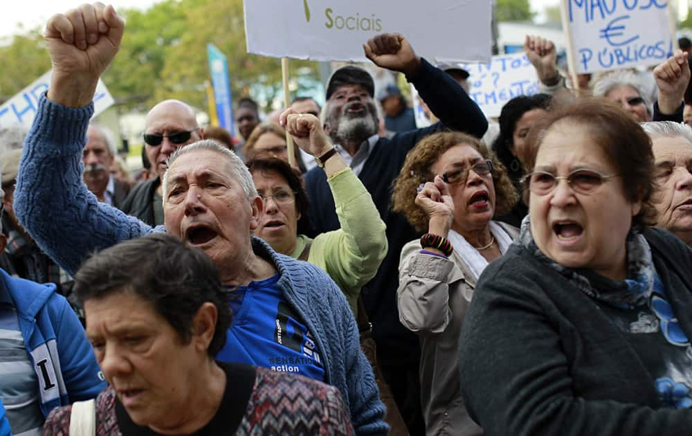 People protest rent hikes and evictions in social housing neighborhoods in Lisbon. Budget cuts have forced the closure of local health centers and reduced subsidies for prescription drugs.