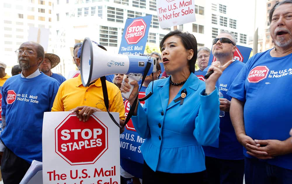 US Congresswoman Judy Chu (D-Calif.) joins US Post Office employees during a protest outside a Staples store, in downtown Los Angeles. 