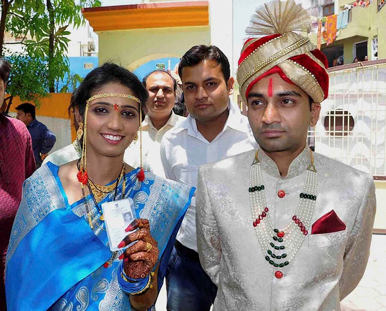 A newly-wed couple before casting their votes for Lok Sabha elections in Ujjain, Madhya Pradesh.