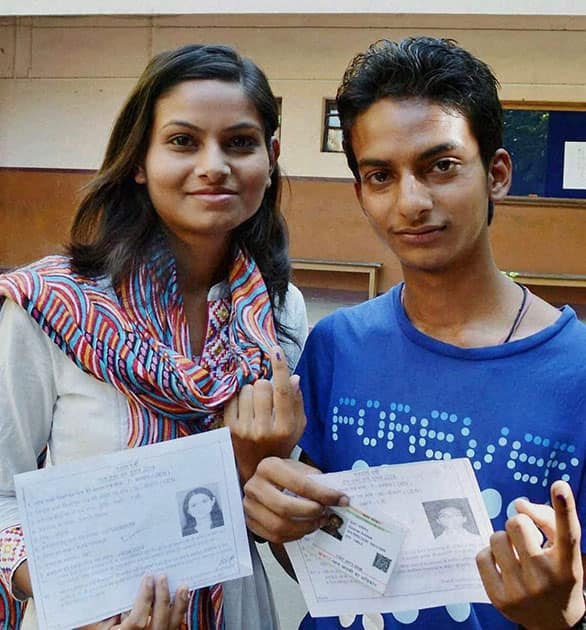 A brother and sister after casting votes at a polling station in Bokaro, Jharkhand.