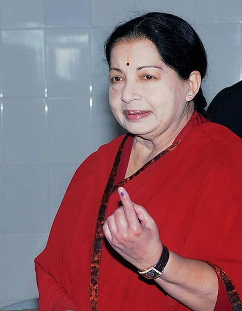 Tamil Nadu Chief Minister and AIADMK supremo Jayalalithaa shows her inked finger after casting her vote for the Lok Sabha election, in Chennai.