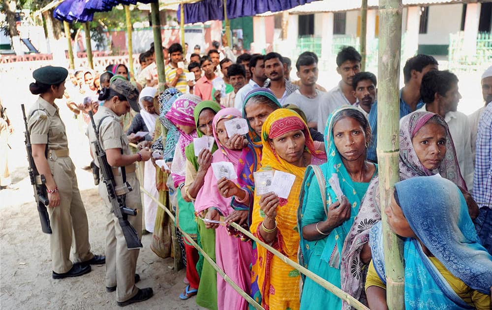 Voters standing in a lqueue to cast their votes in Araria.