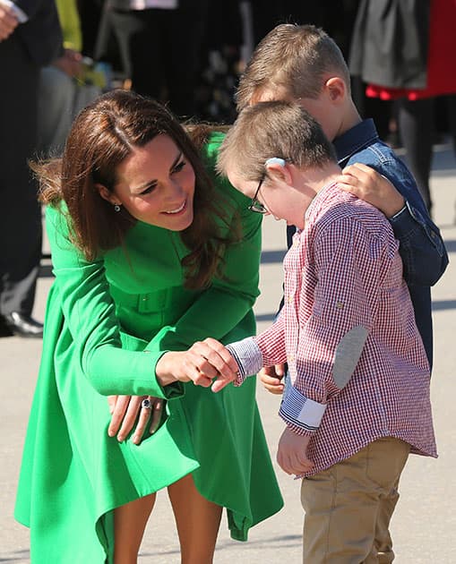 Britain`s Kate, the Duchess of Cambridge meets young school children during a visit to the National Arboretum in Canberra, Australia.