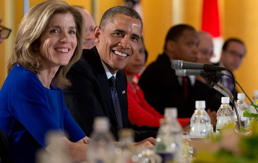 President Barack Obama sits with US Ambassador to Japan Caroline Kennedy, left, during a bilateral meeting with Japanese Prime Minister Shinzo Abe at the Akasaka State Guest House in Tokyo.