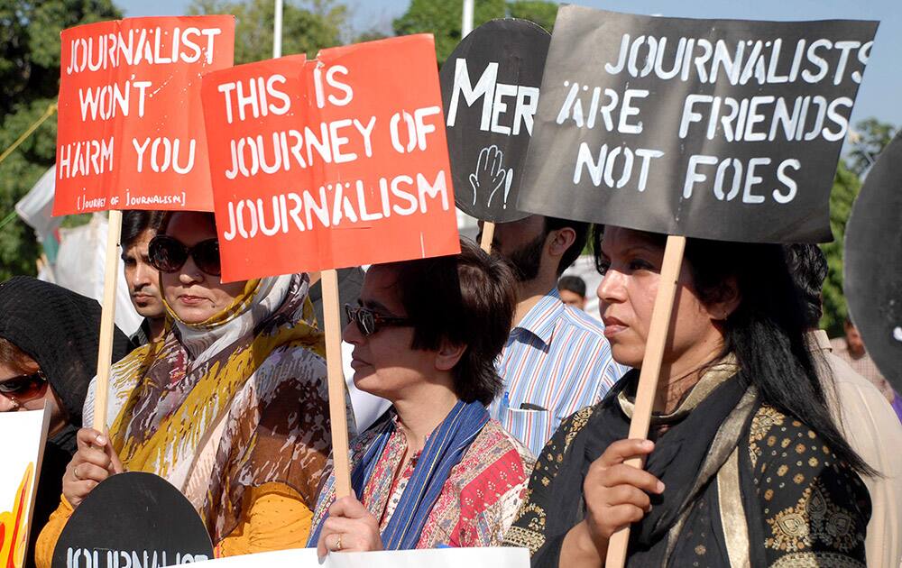 Pakistani journalists protest for their colleague Hamid Mir, who was shot and injured by gunmen in Karachi.