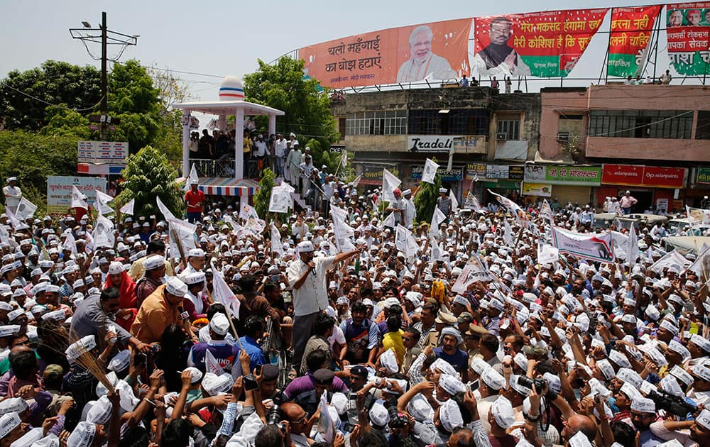 Leader of the Aam Aadmi Party (AAP), or Common Man’s Party, Arvind Kejriwal addresses supporters before filing his nomination in Varanasi, in the northern Indian state of Uttar Pradesh.