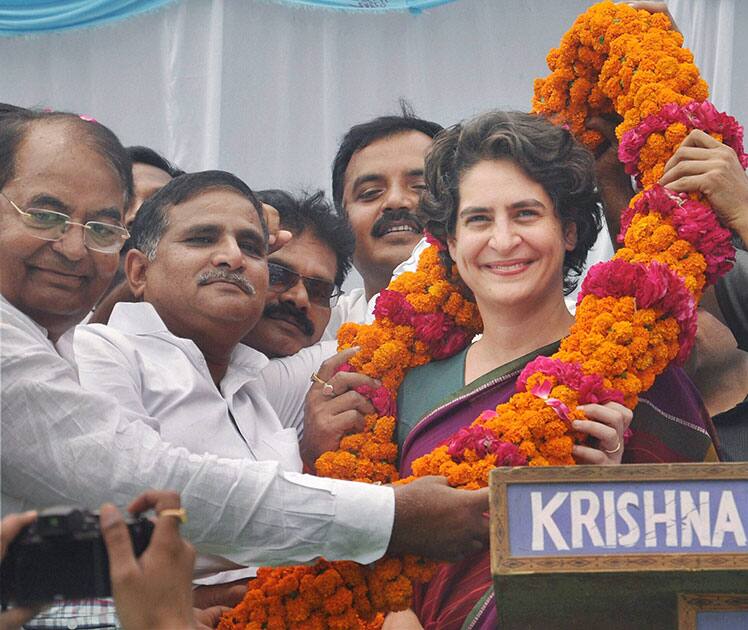 Priyanka Vadra is garlanded during an election campaign for her mother and Congress President Sonia Gandhi in Raebareli.