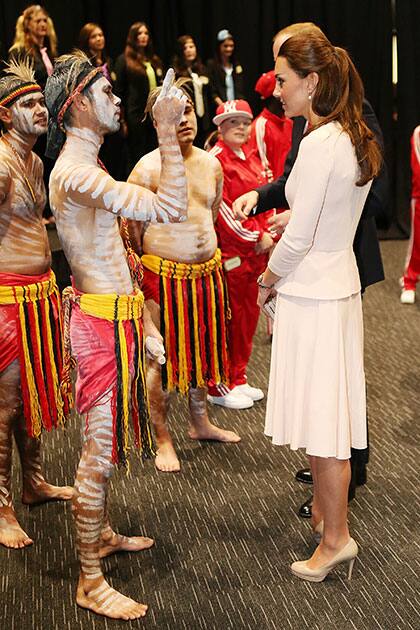 Britain`s Kate, the Duchess of Cambridge, right, speaks to performers during a visit to the youth community center, The Northern Sound System, in the suburb of Elizabeth, in Adelaide, Australia.