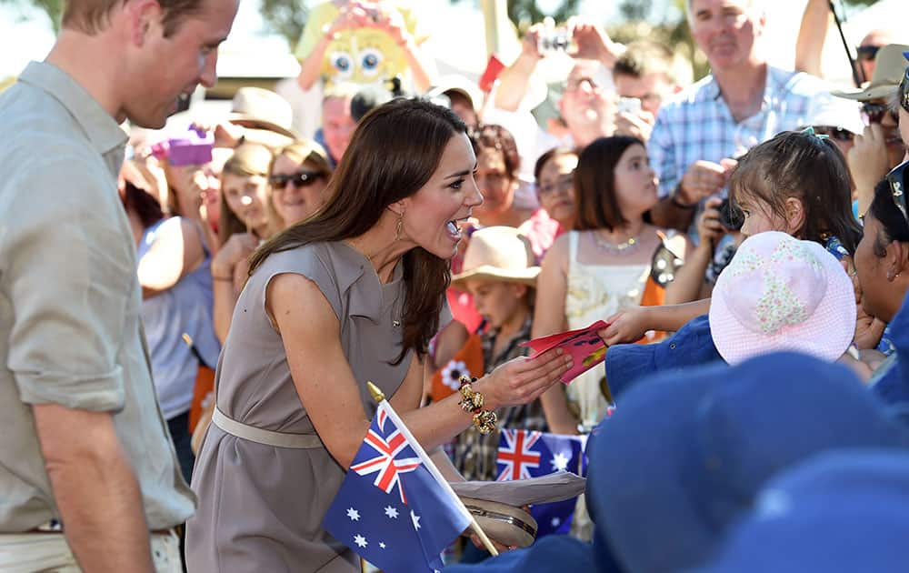 Britain`s Prince William and Kate Duchess of Cambridge speak to locals during a visit to the National Indigenous Training Academy at Uluru, Australia.