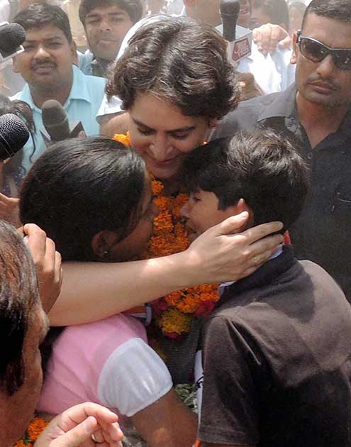 Priyanka Vadra hugs kids during an election campaign for her mother and Congress President Sonia Gandhi in Raebareli.