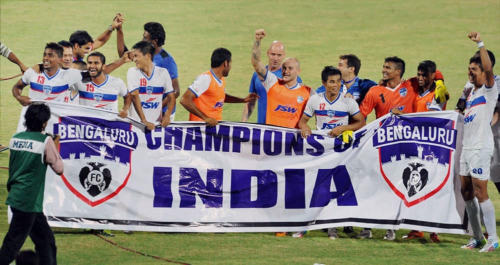 Bengaluru Football Club team members celebrate after winning I-League 2014 championship at Nehru Stadium in Margao, Goa on Monday evening.