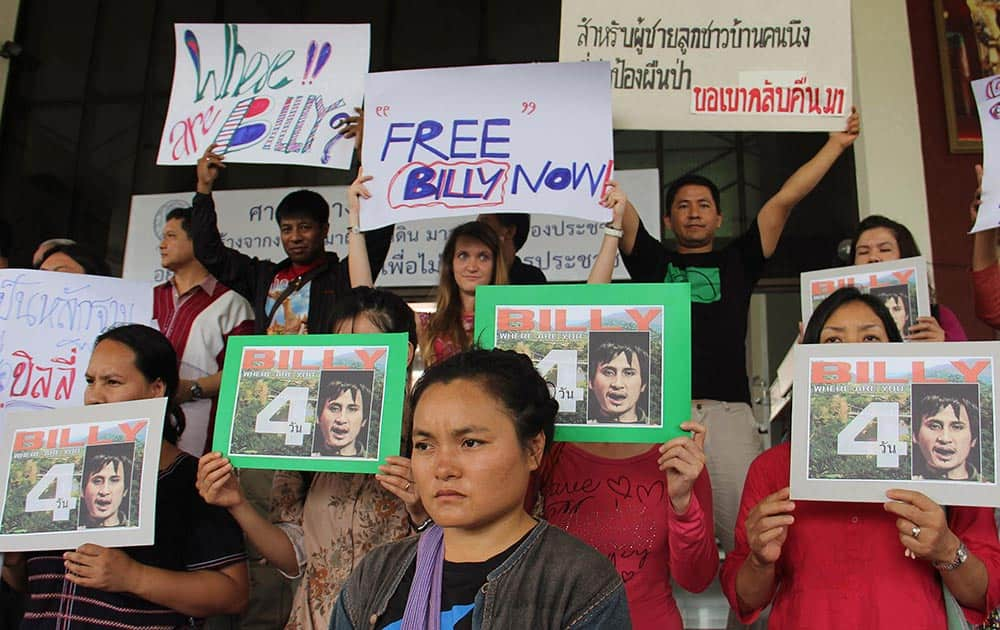 Karen activists, residing in the northern province of Chiang Mai, hold banners and pictures during a rally demanding Thai authorities to speed up the investigation and bring back their missing colleague Por Cha Lee Rakcharoen, known as `Billy,` outside the governor`s office, in Chiang Mai province, northern Thailand.