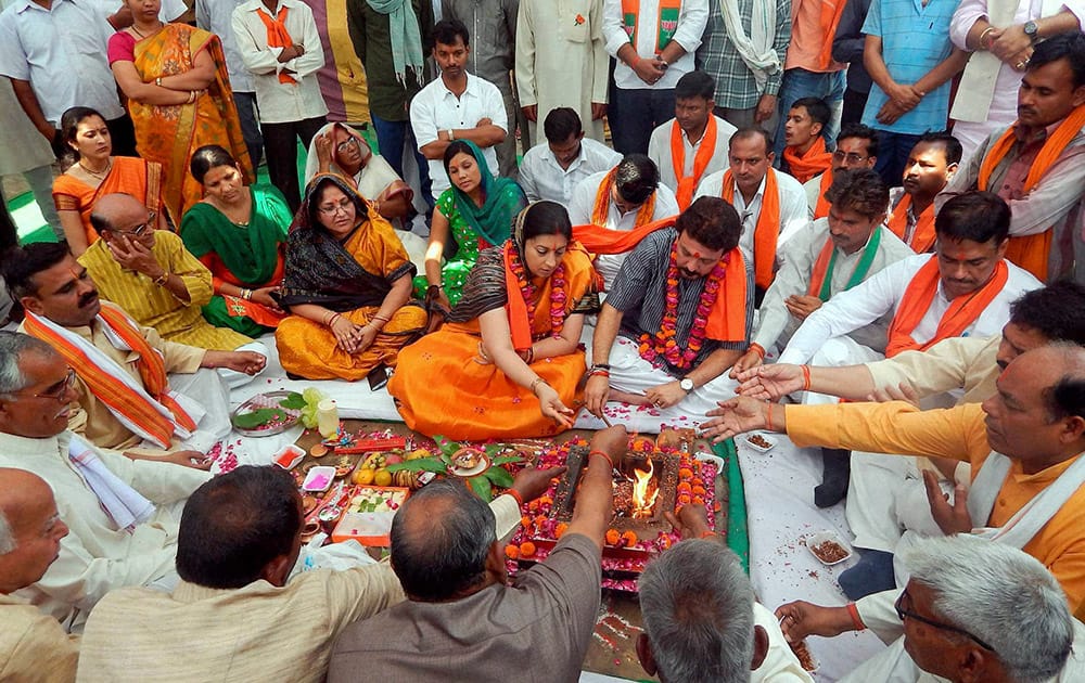 BJP candidate Smriti Irani perform a `puja` before filing her nomination papers for Lok Sabha polls in Amethi.