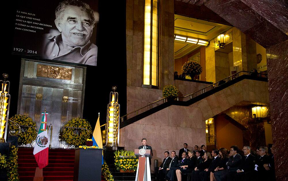 Colombia`s President Juan Manuel Santos speaks as he stands next to the urn containing the ashes of Colombian Nobel Literature laureate Gabriel Garcia Marquez during the authors homage at the Palace of Fine Arts in Mexico City.