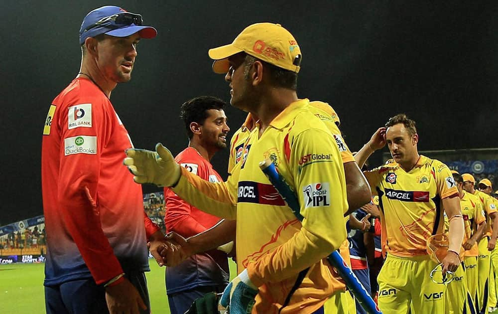 MS Dhoni captain of The Chennai Superkings and Kevin Peter Pietersen of the Delhi Daredevils shakes hand after the IPL-7 match at the Zayed Cricket Stadium in Sharjah, United Arab Emirates.