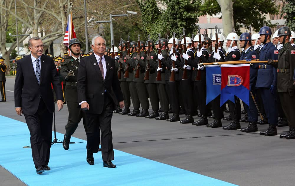 Turkish Prime Minister Recep Tayyip Erdogan, left, and his Malaysian counterpart Najib Razak inspect a military honour guard during a ceremony in Ankara, Turkey.