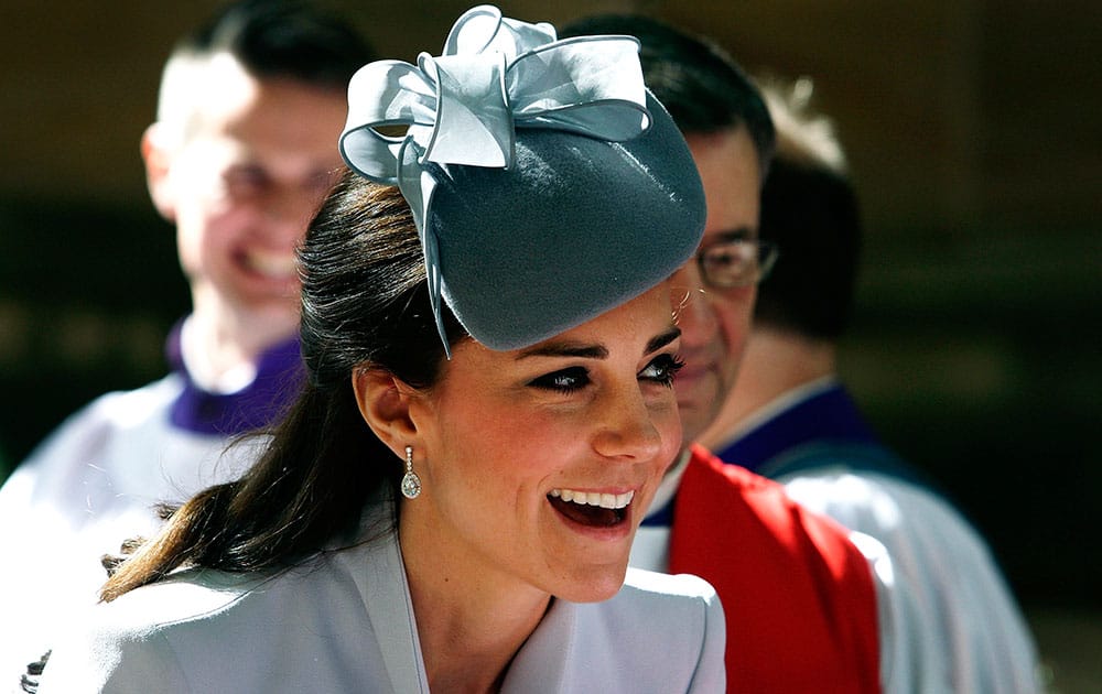 Britain`s Kate, the Duchess of Cambridge, meets members of the cathedral choir following an Easter Sunday service at St. Andrews Cathedral in Sydney.