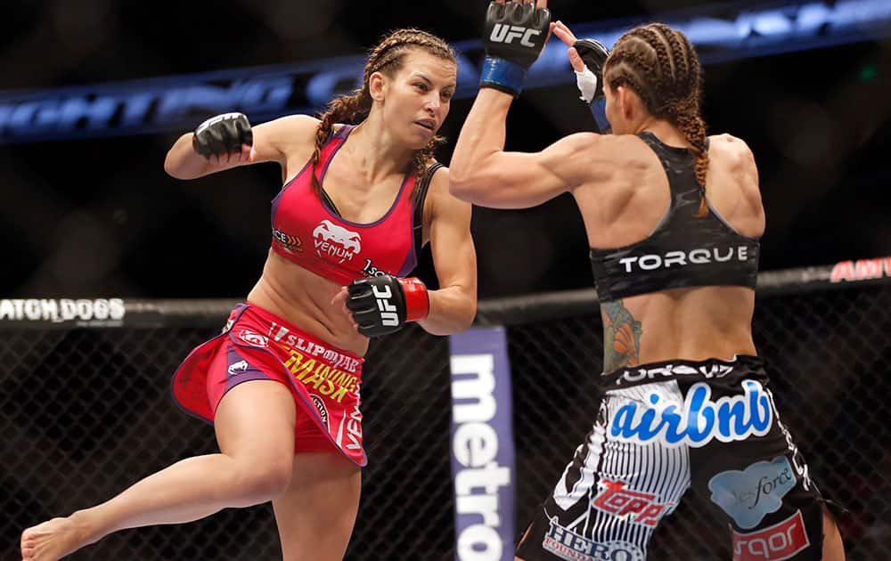 Miesha Tate, left, and Liz Carmouche fight in a mixed martial arts event at UFC Fight Night in Orlando Fla. Tate defeated Carmouche. 