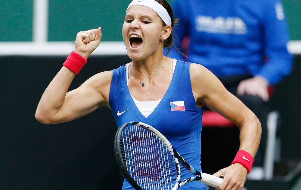 Czech Republic`s Lucie Safarova celebrates after defeating Italy`s Sara Errani in a Fed Cup semifinal tennis match in Ostrava, Czech Republic.