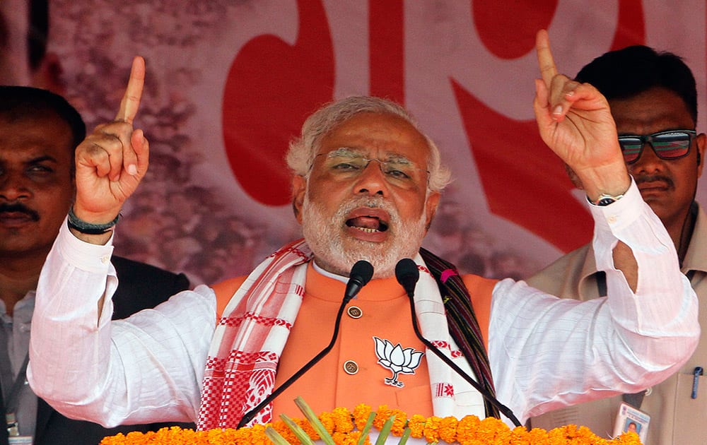 Narendra Modi speaks during an election campaign rally in Nagaon, in the northeastern Indian state of Assam.