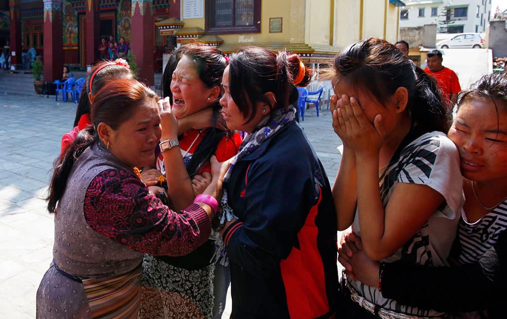 Family members of Nepalese mountaineer Ang Kaji Sherpa, killed in an avalanche on Mount Everest, cry as his body is brought to the Sherpa Monastery in Katmandu.