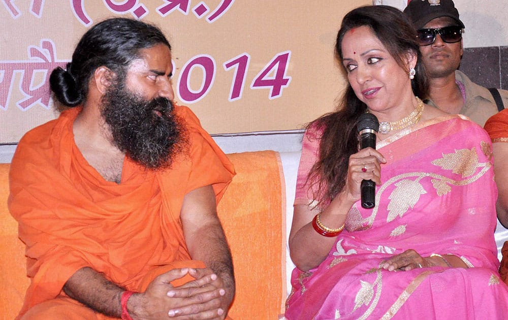 Actress & BJP candidate Hema Malini with Baba Ramdev addressing in press conference in vrindavan.