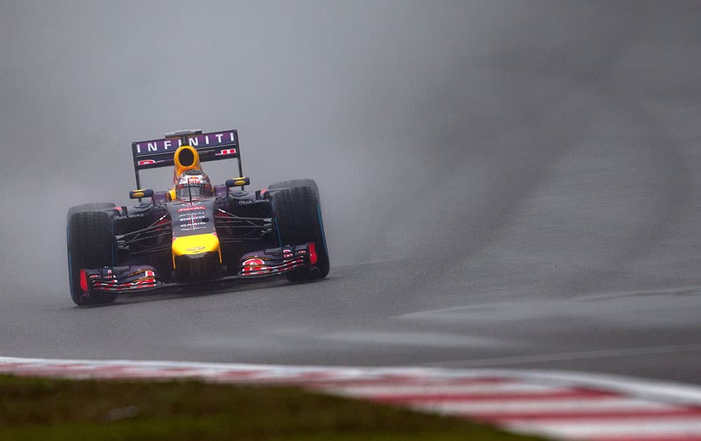 Red Bull Racing driver Sebastian Vettel of Germany drives during the qualifying session of the Chinese Formula One Grand Prix at Shanghai International Circuit in Shanghai, China.