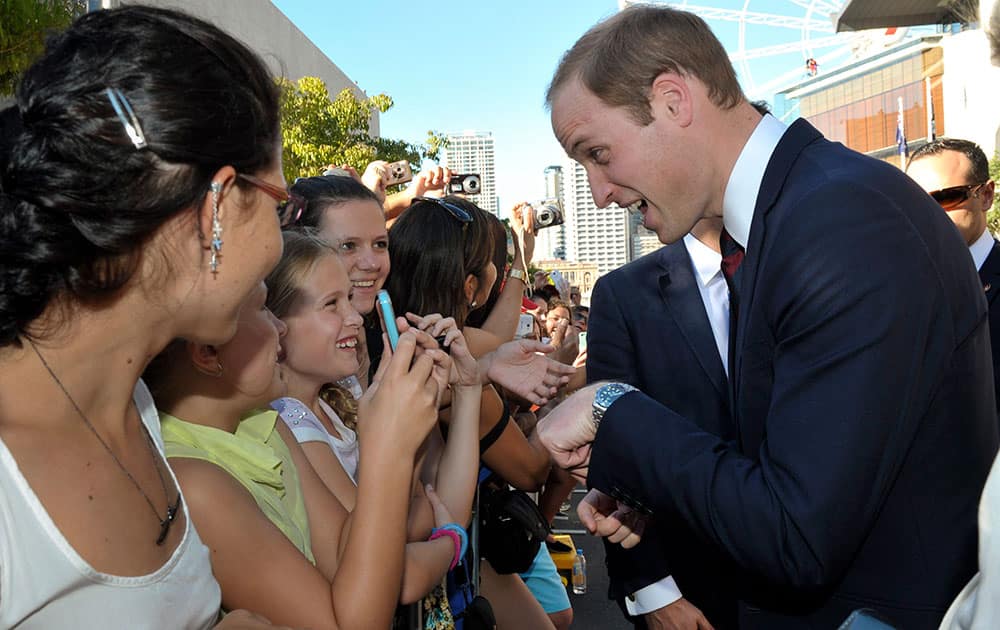 Britain`s Prince William, right, greets members of the public after a reception at the Brisbane Convention & Exhibition Centre, in Brisbane, Australia.