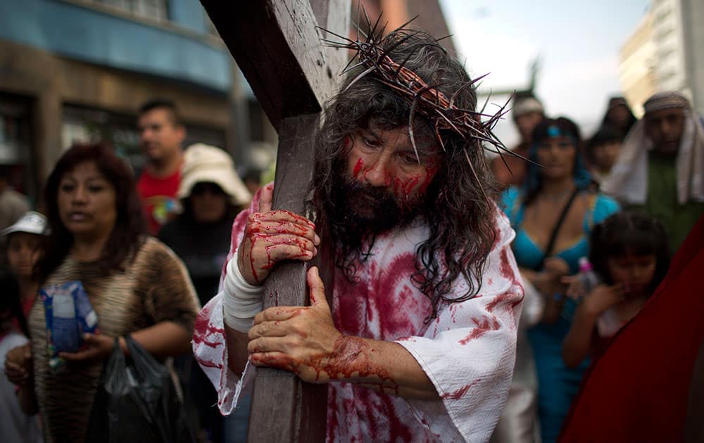 Jesus Christ, portrayed by Mario Valencia, better known as `Cristo Cholo,` reenacts the Passion of Christ in Lima, Peru.