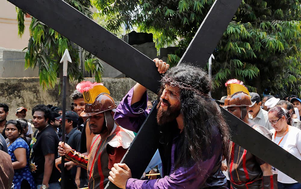 A Christian devotee re-enacts the crucifixion of Jesus Christ to mark Good Friday in Mumbai.